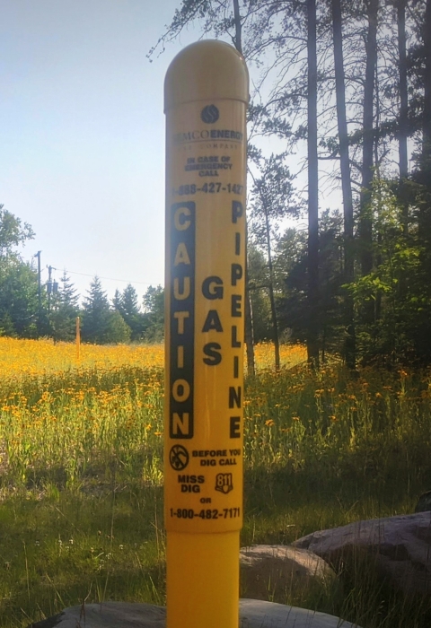 A gas pipeline maker with pollinator habitat along a right-of-way