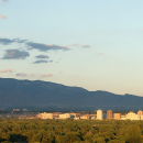 a panoramic view of downtown Albuquerque and the Sandia Mountains