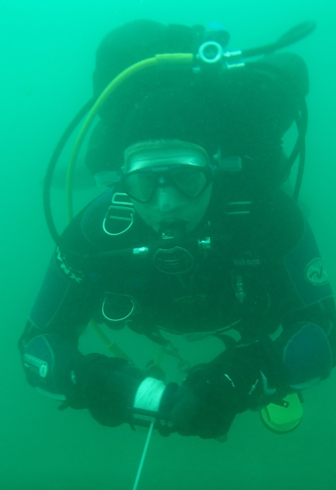 scuba diver swimming underwater