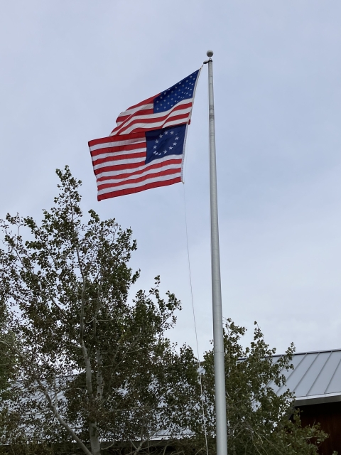 2 US flags fly