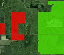 Image showing two closed tracts of land in red on the west side of Omega Road and one tract of land open to some public use in green on the east side of Omega Road. 