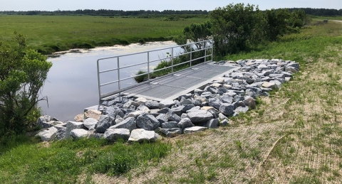 Water control structure used to regulate the flow between water bodies and control the spread of aquatic invasive species.structure designed to control water entering Lake Erie.