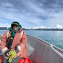 Monica Iglecia in a boat on Copper River Delta