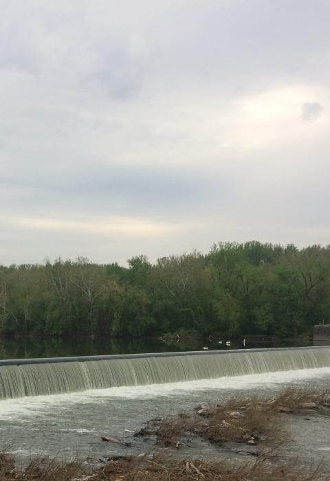 Dam along the Potomac River with a small boat in the water