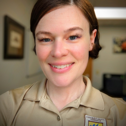 Woman in FWS uniform smiling