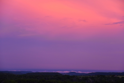 the sky glows pink and purple at sunset