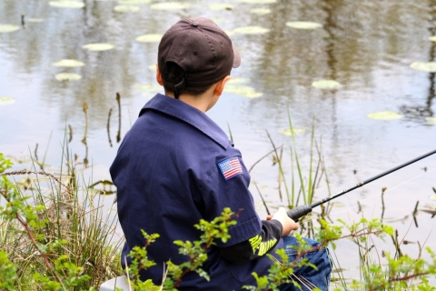 Child fishing at a wetland in Hadley, Massachusetts.