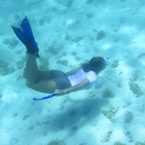 Mady swimming under water