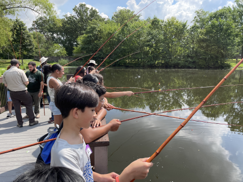 Children fishing during Cops N' Bobbers Fishing Program