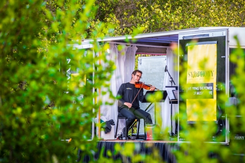 A pianist performs with a string quartet at a national wildlife refuge