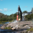 large jackhammer removes concrete dam