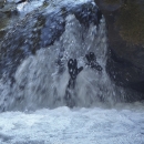 a person under a waterfall