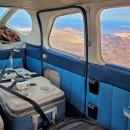 Ice chests containing woundfin with aerators inside plane mid flight.