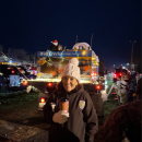 USFWS employee in front of decorated distribution truck