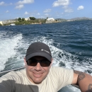 Biologist, Iván Llerandi-Román in a boat during a field visit.